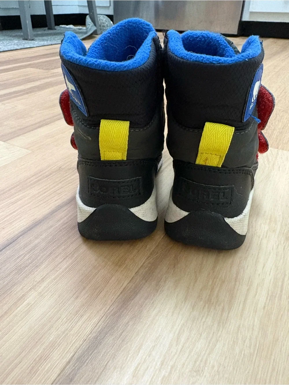 Sorel Kids Black Boots with Blue Fleece Lining